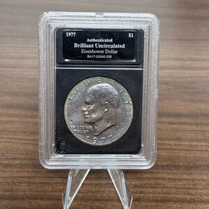 1977 Authenticated Brilliant Uncirculated Eisenhower 1$ Coin Beautiful toning